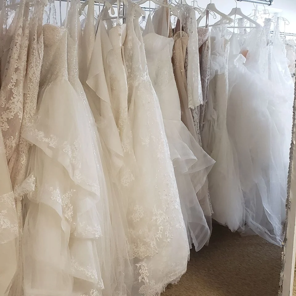 Wedding gowns on the racks at the Love Bridal salon